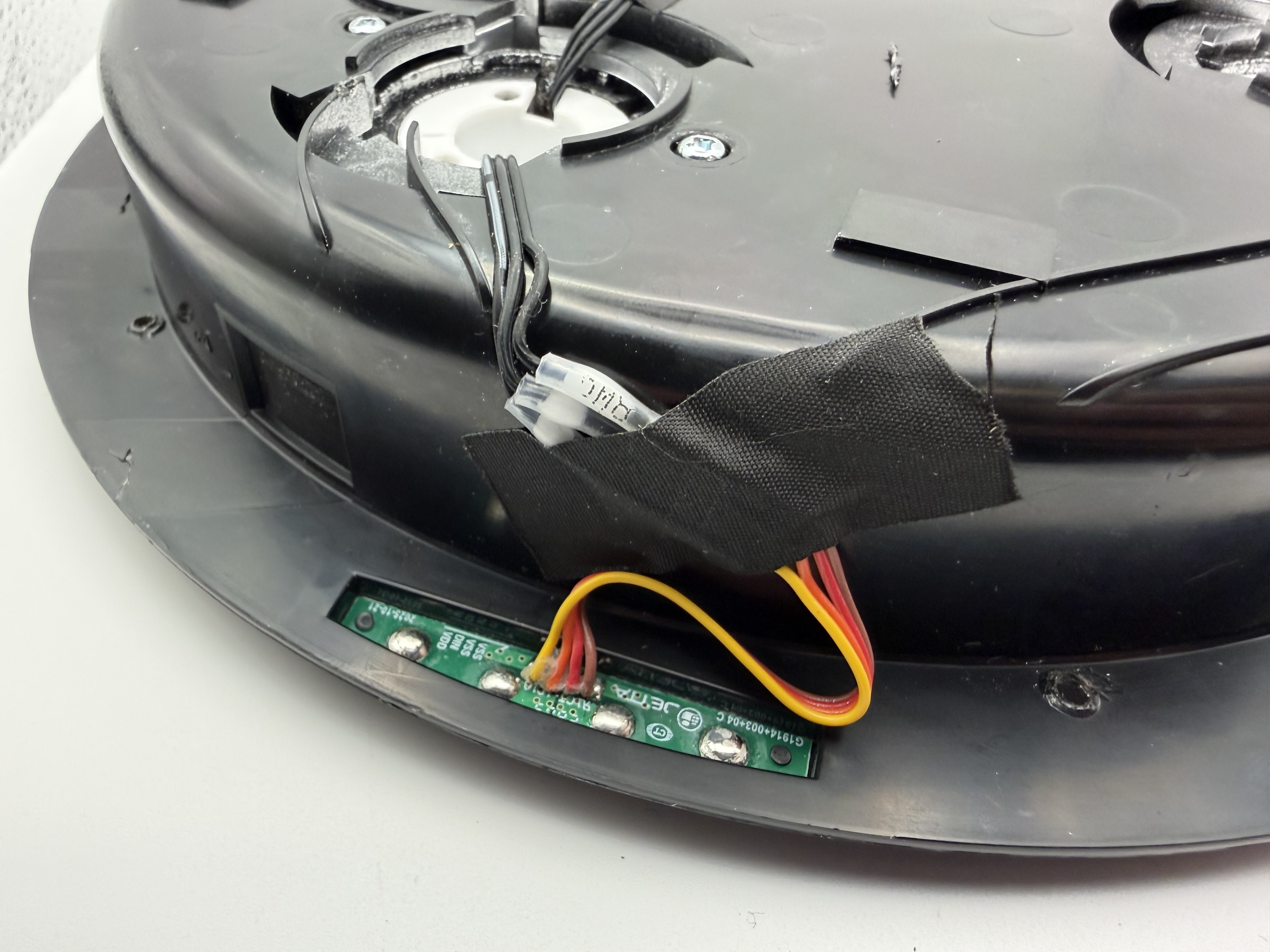 Completed solder-seal wiring connections taped and secured on the cyclotron lid