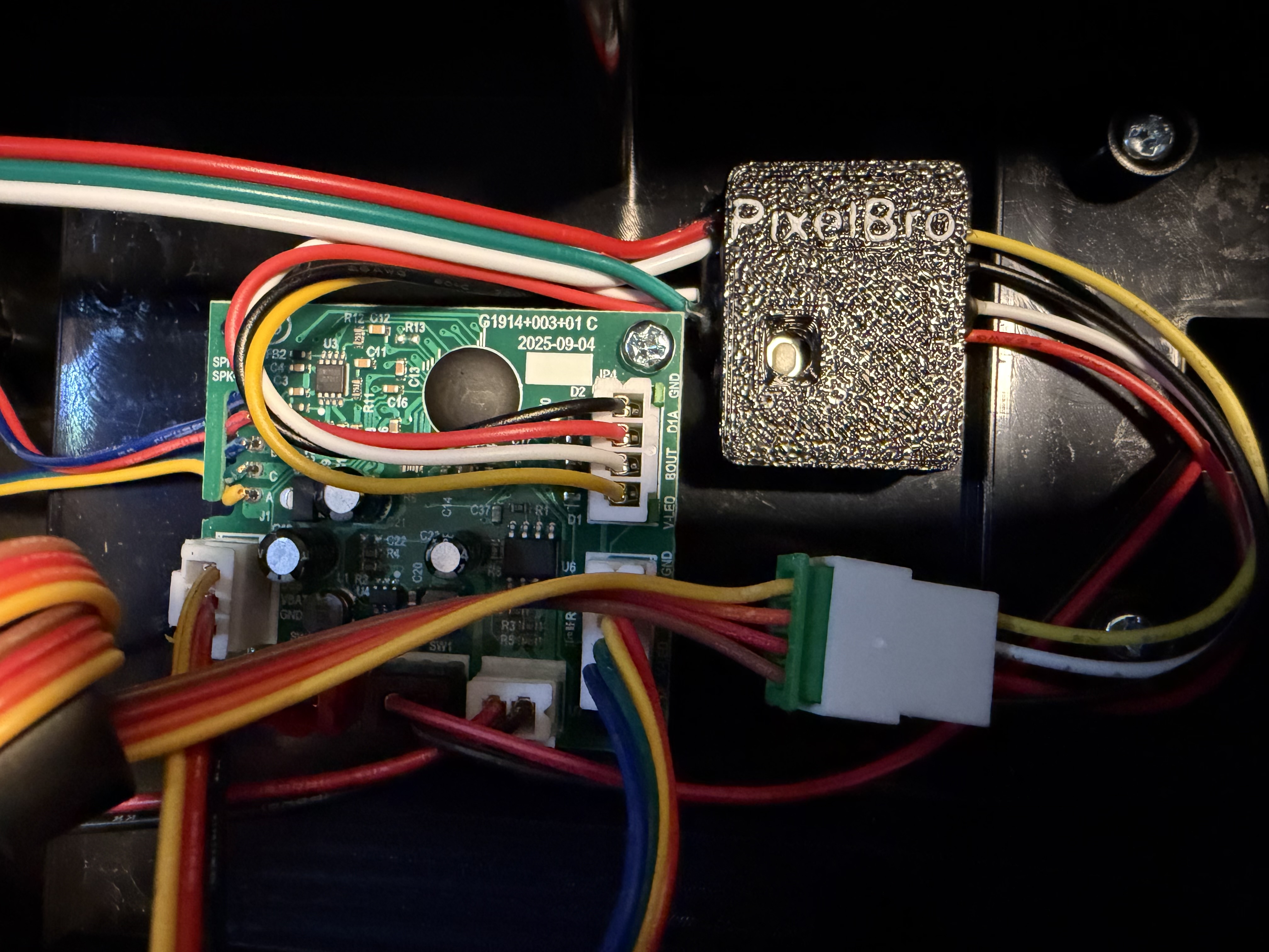 PixelBro controller installed beside the factory Proton Pack electronics PCB with its connectors plugged in
