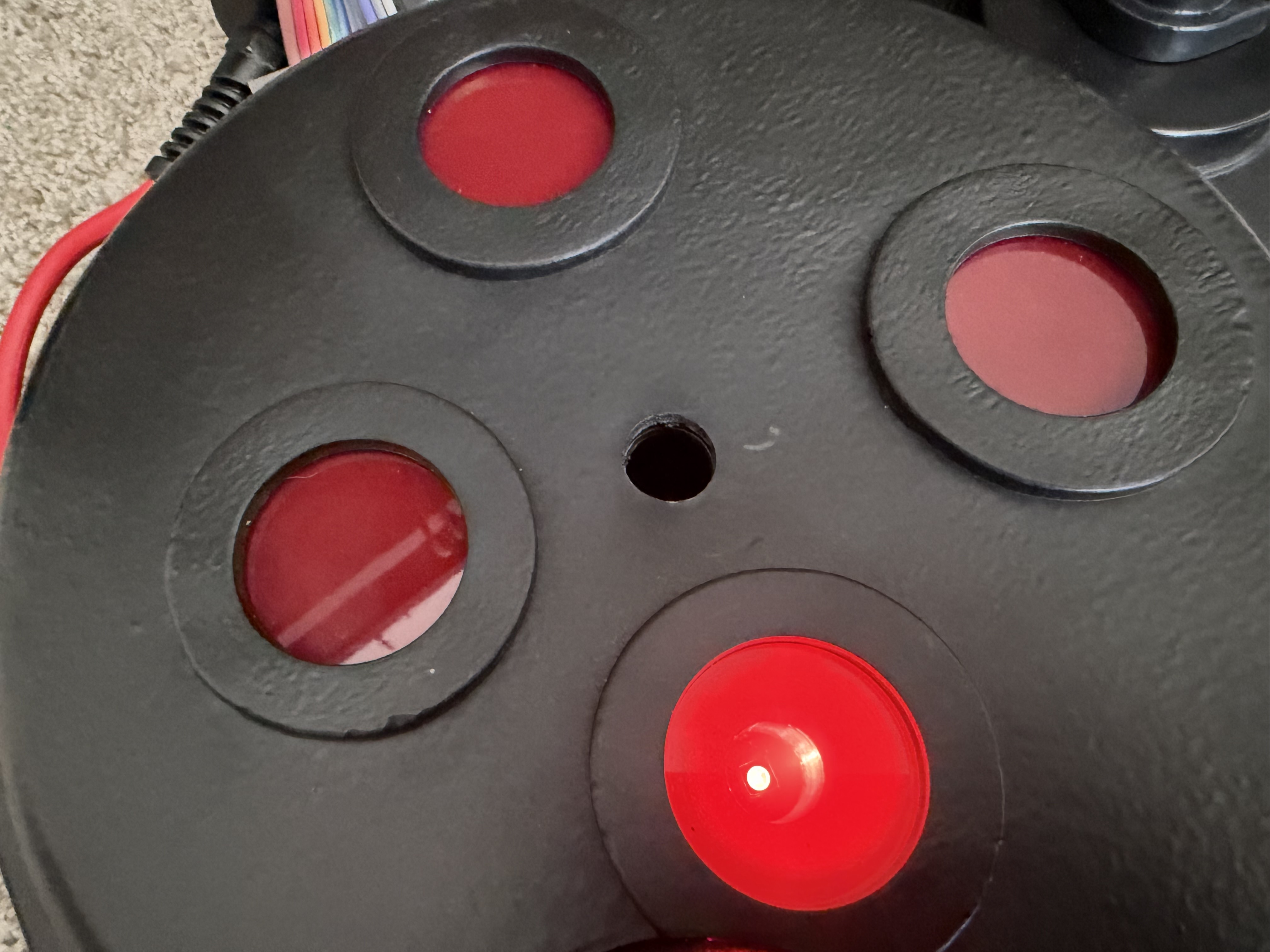 Recessed emitter glowing red inside a Hasbro 1984 Proton Pack cyclotron lid